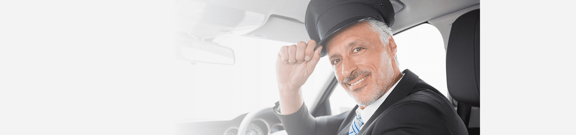 Professional chauffeur driving luxury vehicle